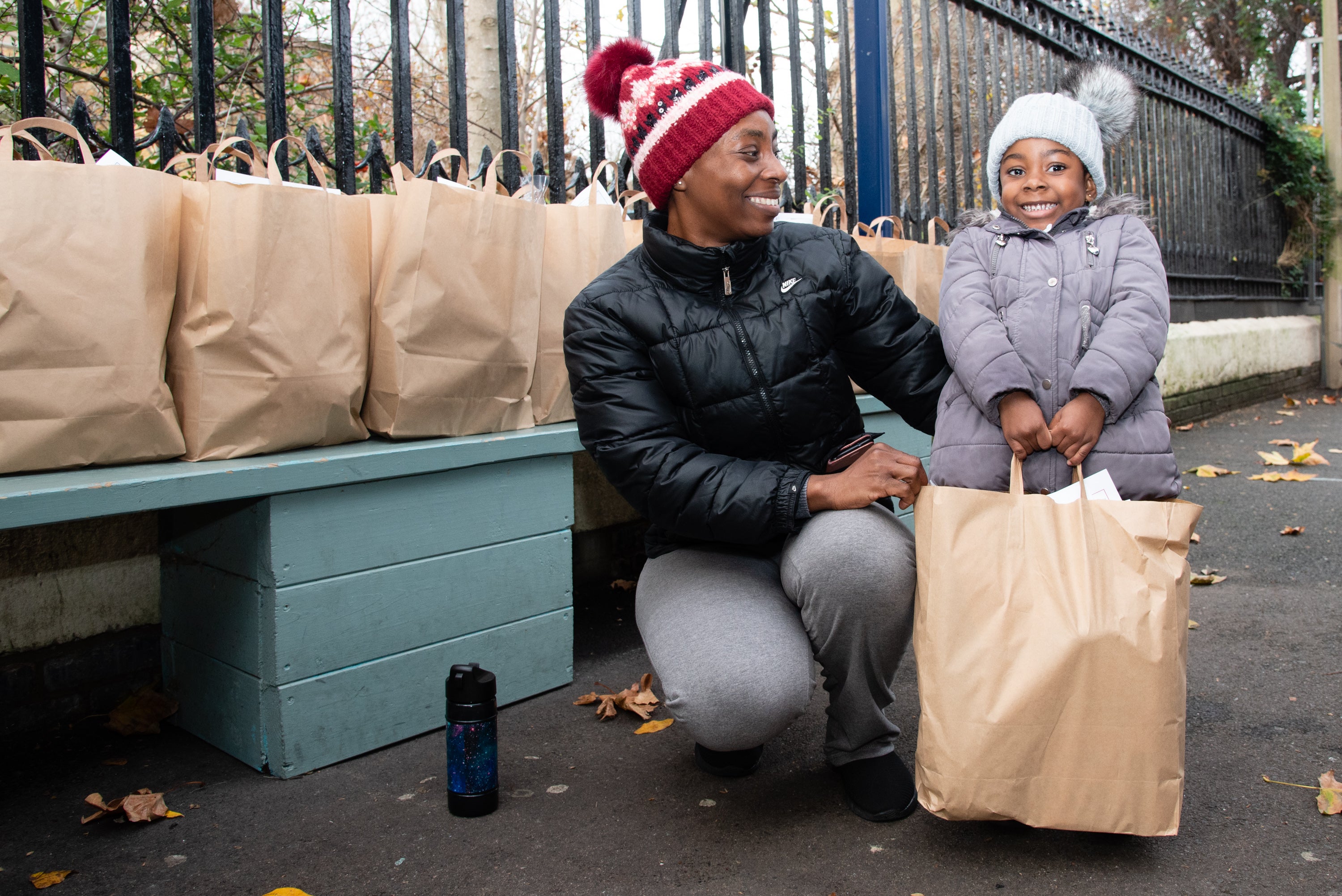 A family receives a breakfast box at a school in Southwark, thanks to the Unicef UK-funded project School Food Matters