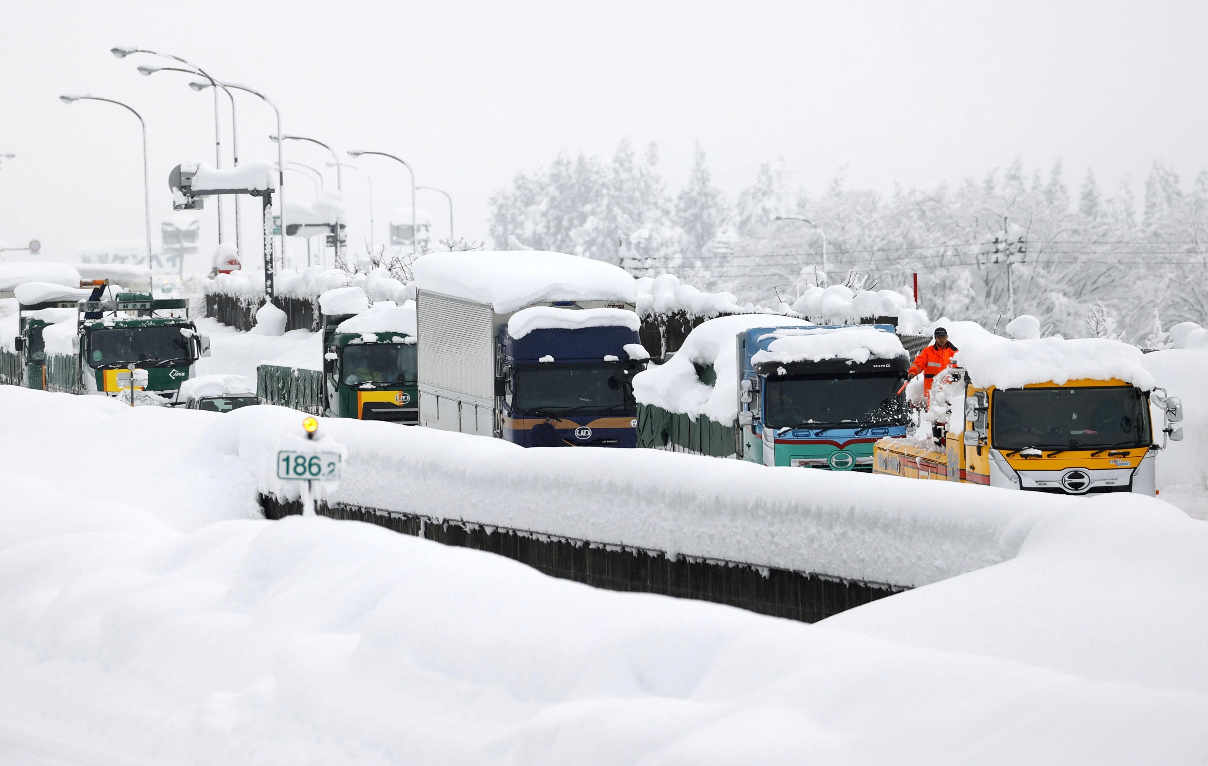 Vehicles are stranded on the snow-covered Kanetsu expressway in Minamiuonuma in Niigata Prefecture, Japan&nbsp;