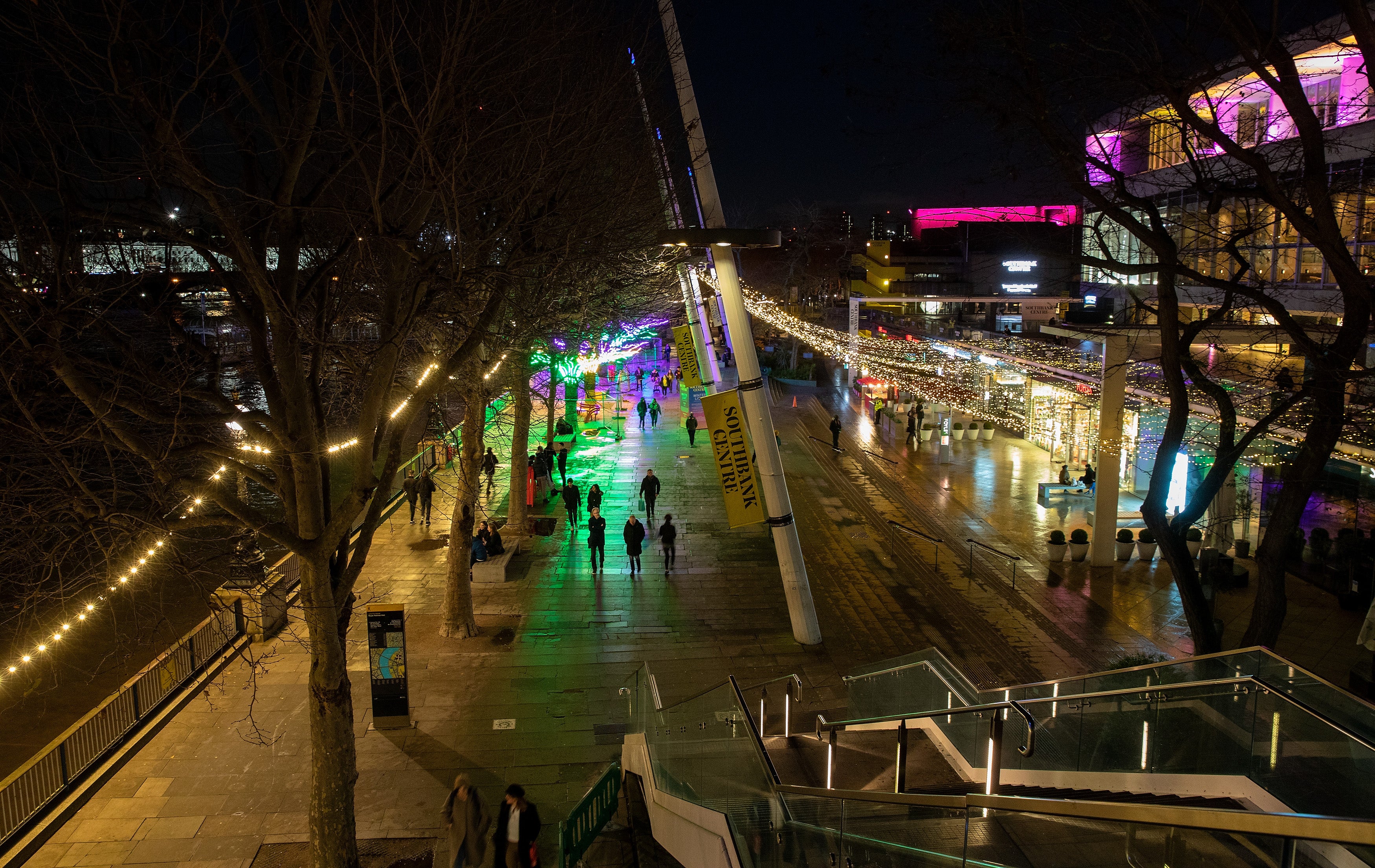 A view of people walking along Southbank lit with Christmas Lights during Tier 3 of the Covid-19 Pandemic Lockdown on 17 December 2020 in London.