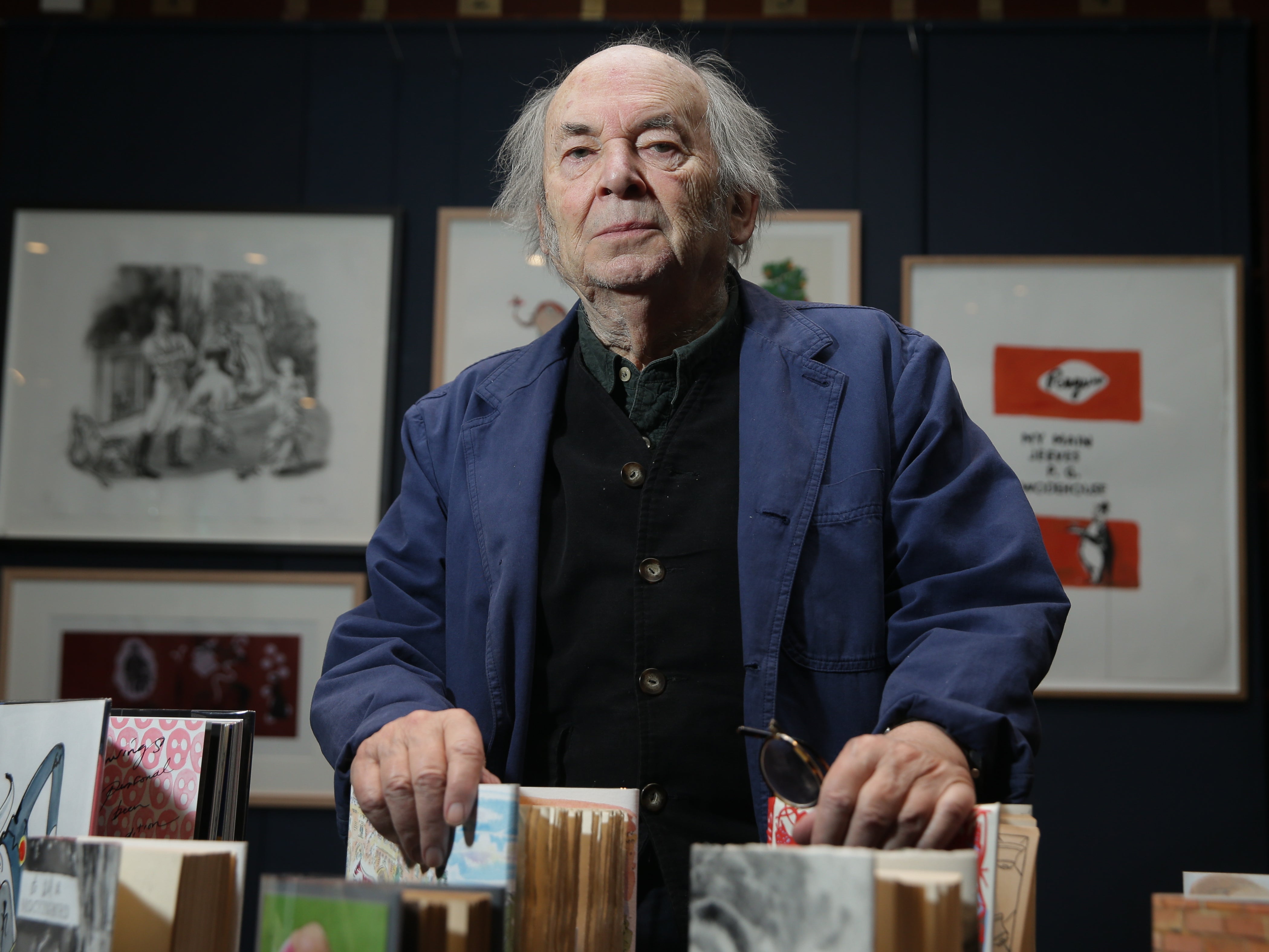 Blake poses with first editions of his books in 2017