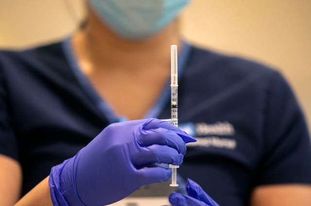 <p>Medical professionals at Stanford Medical Center held a demonstration on Friday to protest vaccine distribution plans</p>