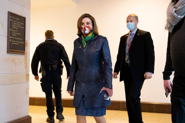 <p>Speaker of the House Nancy Pelosi walks to a meeting on Capital Hill in Washington DC, USA, 18 December 2020.</p>
