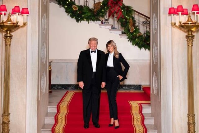 <p>Donald and Melania Trump wear matching tuxedos in their final Christmas card from the White House</p>