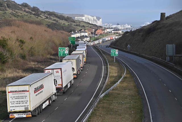 Freight lorries queue on the main route into the port of Dover on the south coast of England on Thursday 17 December 2020