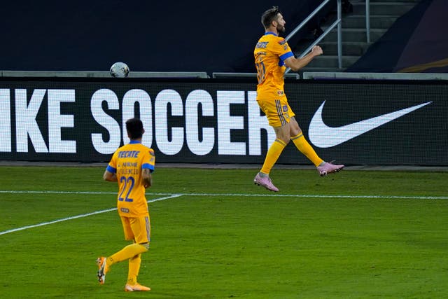 <p>El francés André Pierre Gignac salta para festejar uno de sus tantos con los Tigres de México ante el Olimpia de Honduras, el sábado 19 de diciembre de 2020, en la semifinal de la Liga de Campeones de la Concacaf. El encuentro se realizó en Orlando, Florida.</p>