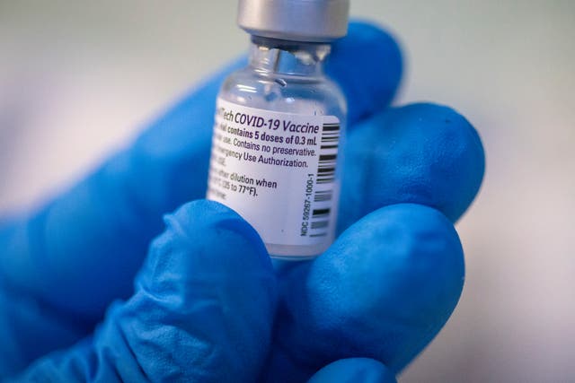 A medical staff member prepares a Pfizer-BioNTech Covid-19 vaccine