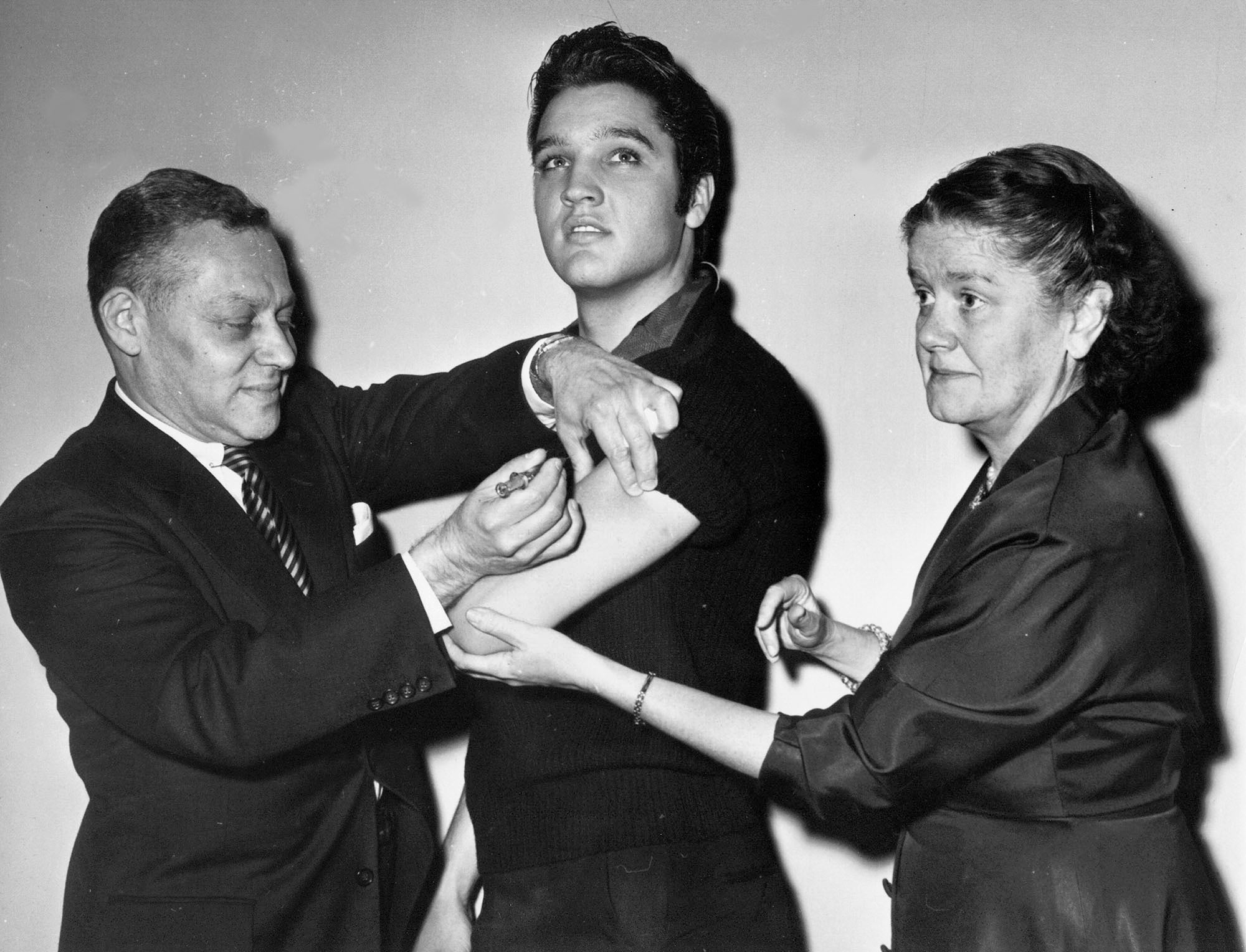 Elvis Presley, then 21 years old, gets a polio vaccine