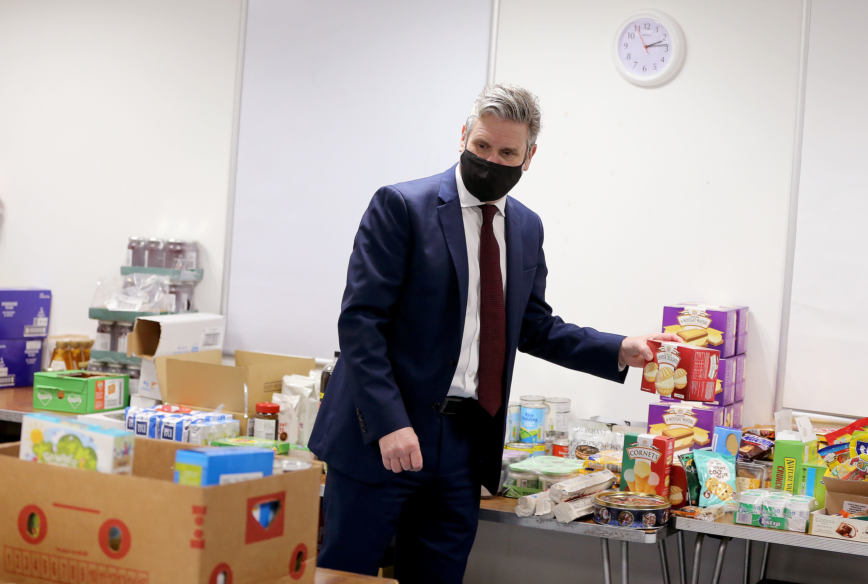 Sir Keir Starmer packs food parcels with volunteers for residents during a visit last week to Lightwaves Leisure Centre in Wakefield