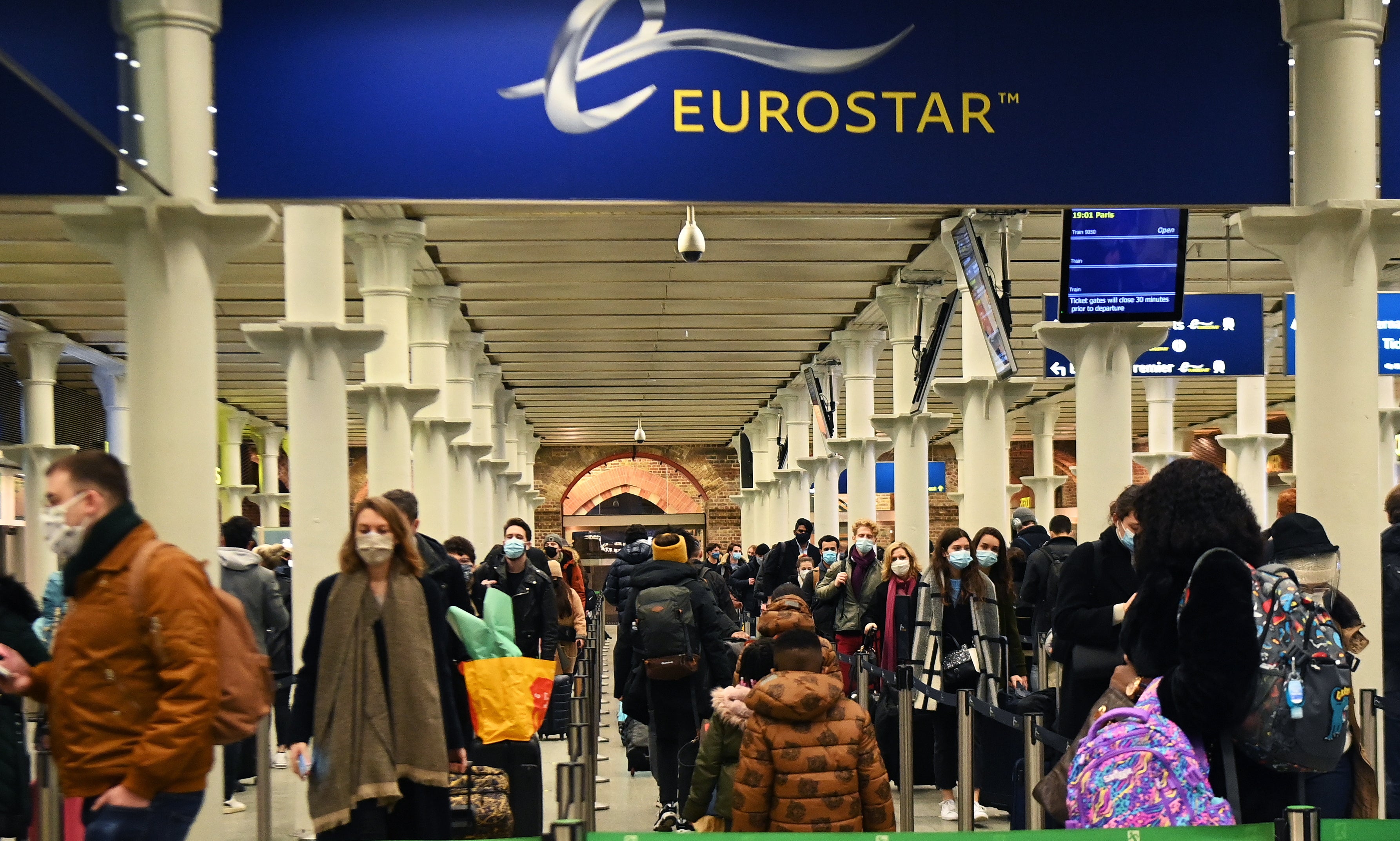 Passengers queue to board the Eurostar to Paris from Kings Cross St Pancras, shortly before France shuts its border to the UK at midnight on 20 December, 2020.