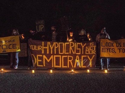 Sunrise Movement protesters at a Wide Awake action outside Pennsylvania Sentor Pat Toomey’s house