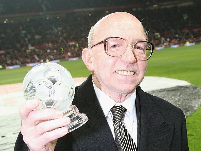 <p>Nobby Stiles poses with a Contribution to Football award</p>