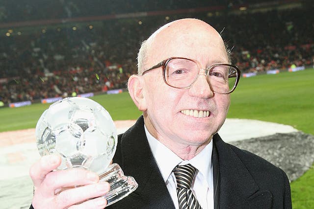 <p>Nobby Stiles poses with a Contribution to Football award</p>