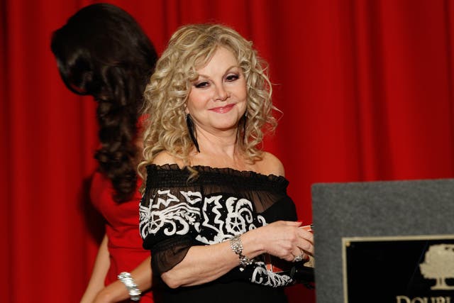 Entertainer Stella Parton speaks at the Stella Parton’s Red Tent Women’s Conference 2014 at the Doubletree Hotel Downtown on 19 April 2014 in Nashville, Tennessee