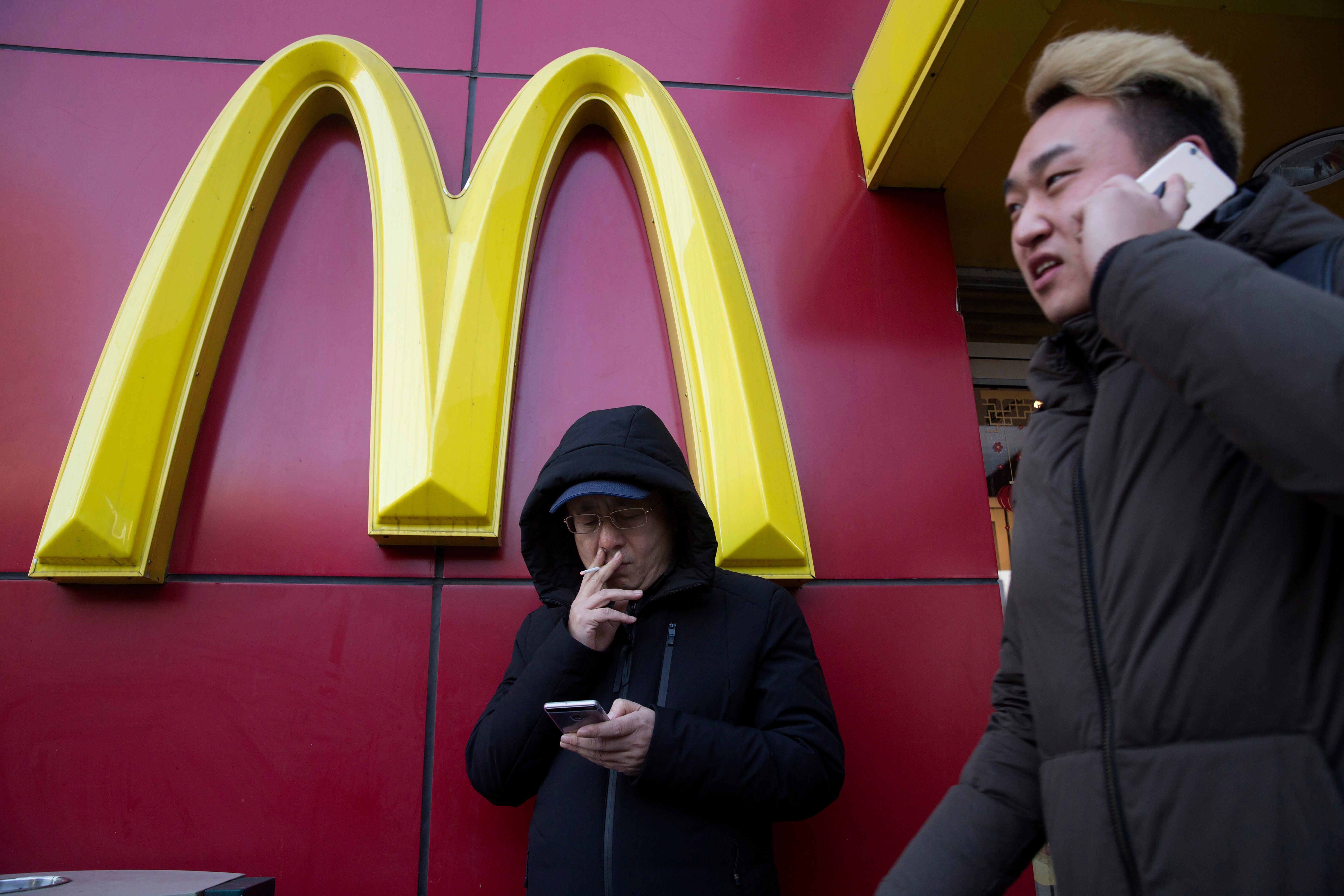 File image: A man outside a McDonald outlet in Beijing &nbsp;