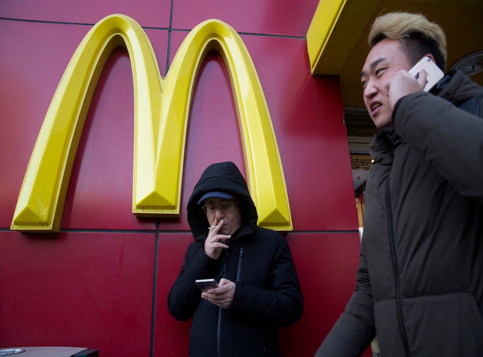 <p>File image: A man outside a McDonald outlet in Beijing &nbsp;</p>