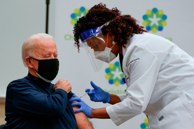 US President-elect Joe Biden receives a Covid-19 vaccination from Tabe Masa, Nurse Practitioner and Head of Employee Health Services, at the Christiana Care campus in Newark, Delaware on December 21, 2020. (Photo by Alex Edelman / AFP) (Photo by ALEX EDELMAN/AFP via Getty Images)