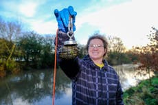 Man pulls 19 hand grenades out of river while magnet fishing