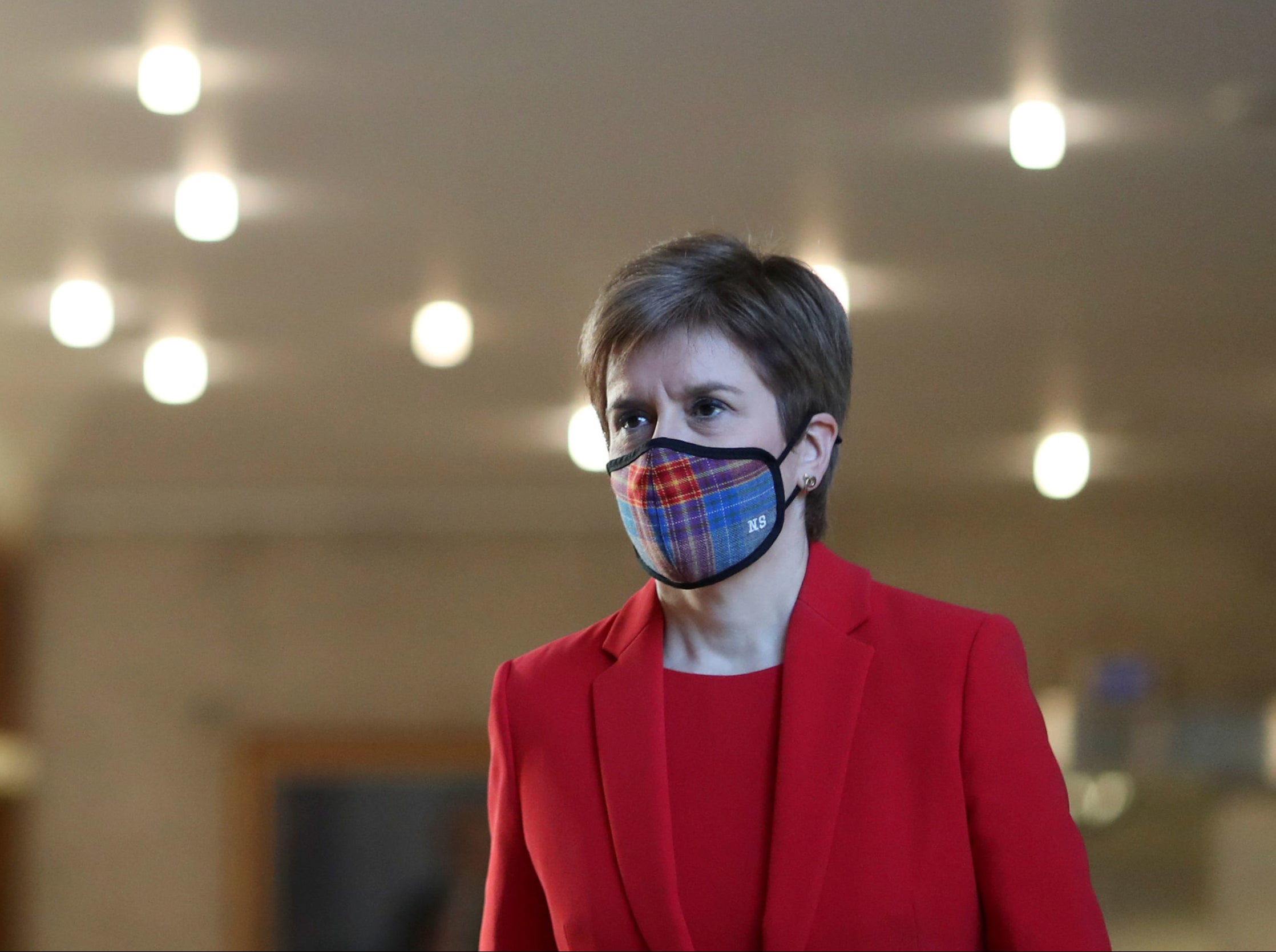 First Minister Nicola Sturgeon arrives ahead of delivering an update on Covid restrictions in the Scottish Parliament