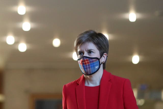 <p>First Minister Nicola Sturgeon arrives ahead of delivering an update on Covid restrictions in the Scottish Parliament</p>