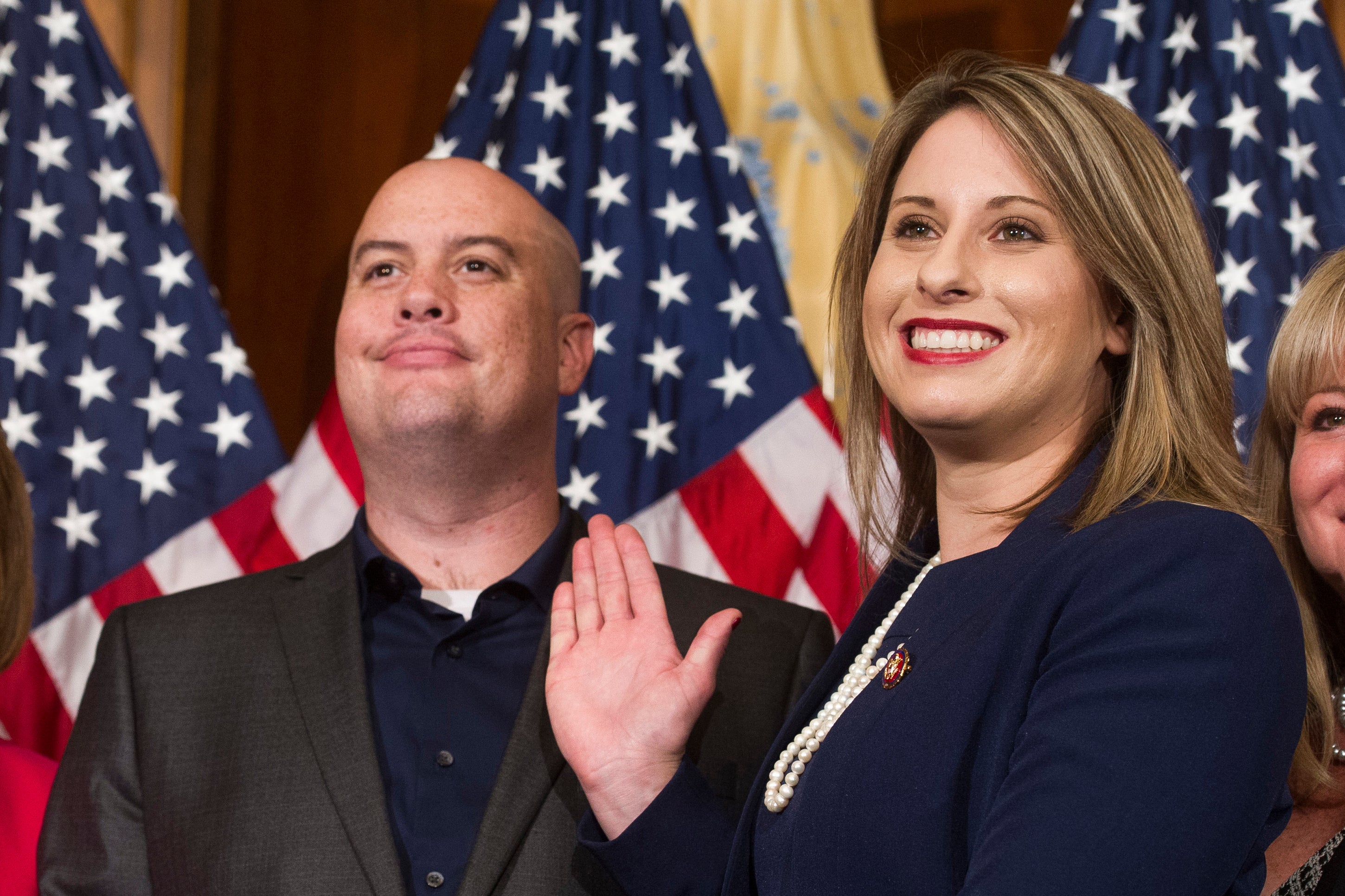 Rep. Katie Hill, D-Calif., and Hill's ex-husband, Kenneth Heslep, pose during a ceremonial swearing in on Capitol Hill in Washington during the opening session of the 116th Congress.