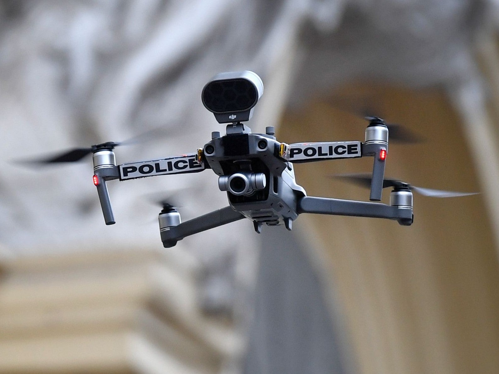 A police drone flies on 24 March, 2020 over Marseille’s Capucins market