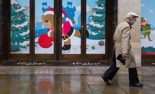 A man walks past closed shops on Regent Street, London. Prime Minister Boris Johnson cancelled Christmas for almost 18 million people across London and eastern and south-east England following warnings from scientists of the rapid spread of the new variant of coronavirus.