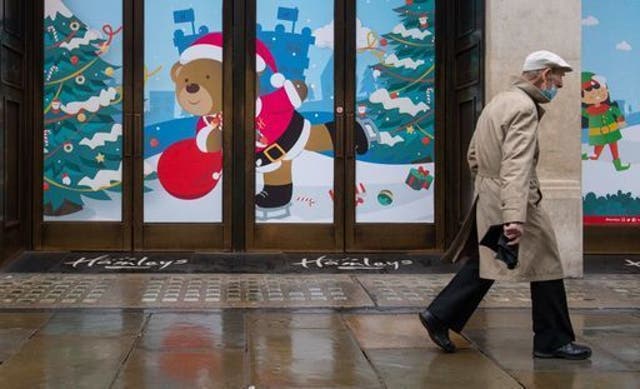 <p>A man walks past closed shops on Regent Street, London. Prime Minister Boris Johnson cancelled Christmas for almost 18 million people across London and eastern and south-east England following warnings from scientists of the rapid spread of the new variant of coronavirus.</p>