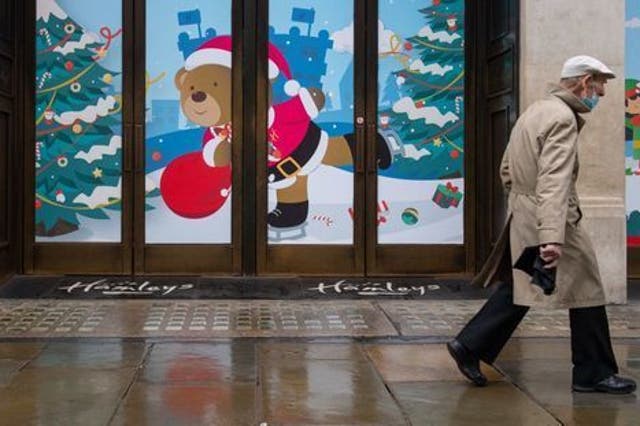 <p>A man walks past closed shops on Regent Street, London. Prime Minister Boris Johnson cancelled Christmas for almost 18 million people across London and eastern and south-east England following warnings from scientists of the rapid spread of the new variant of coronavirus.</p>
