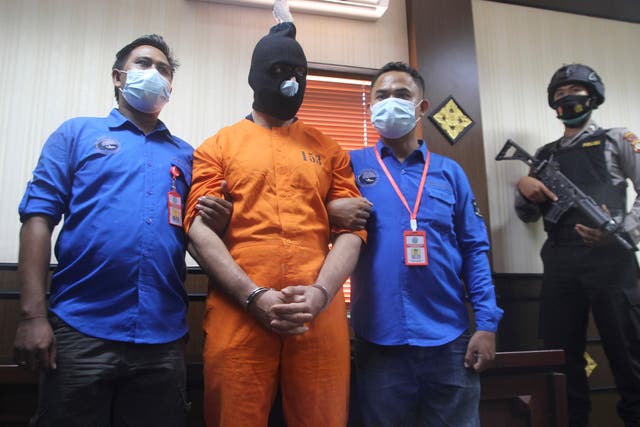 APTOPIX Indonesia Tourist Arrest