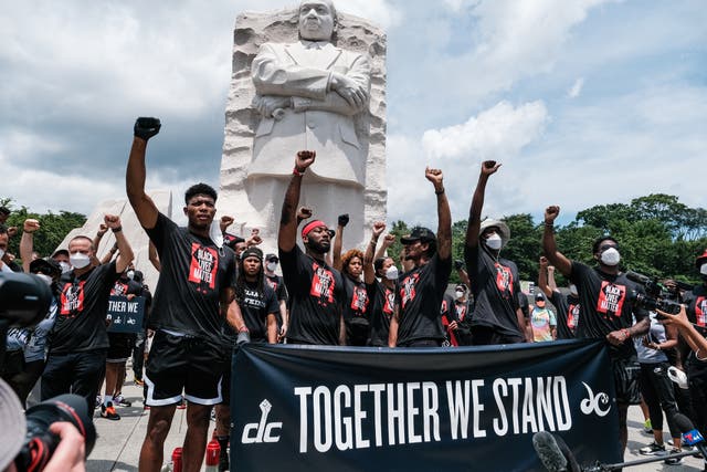 <p>WASHINGTON, DC - JUNE 19: Members of the Washington Wizards and Washington Mystics basketball teams rally at the MLK Memorial to support Black Lives Matter and to mark the liberation of slavery on June 19, 2020 in Washington, DC . Juneteenth commemorates June 19, 1865, when a Union general read orders in Galveston, Texas stating all enslaved people in Texas were free according to federal law. </p>