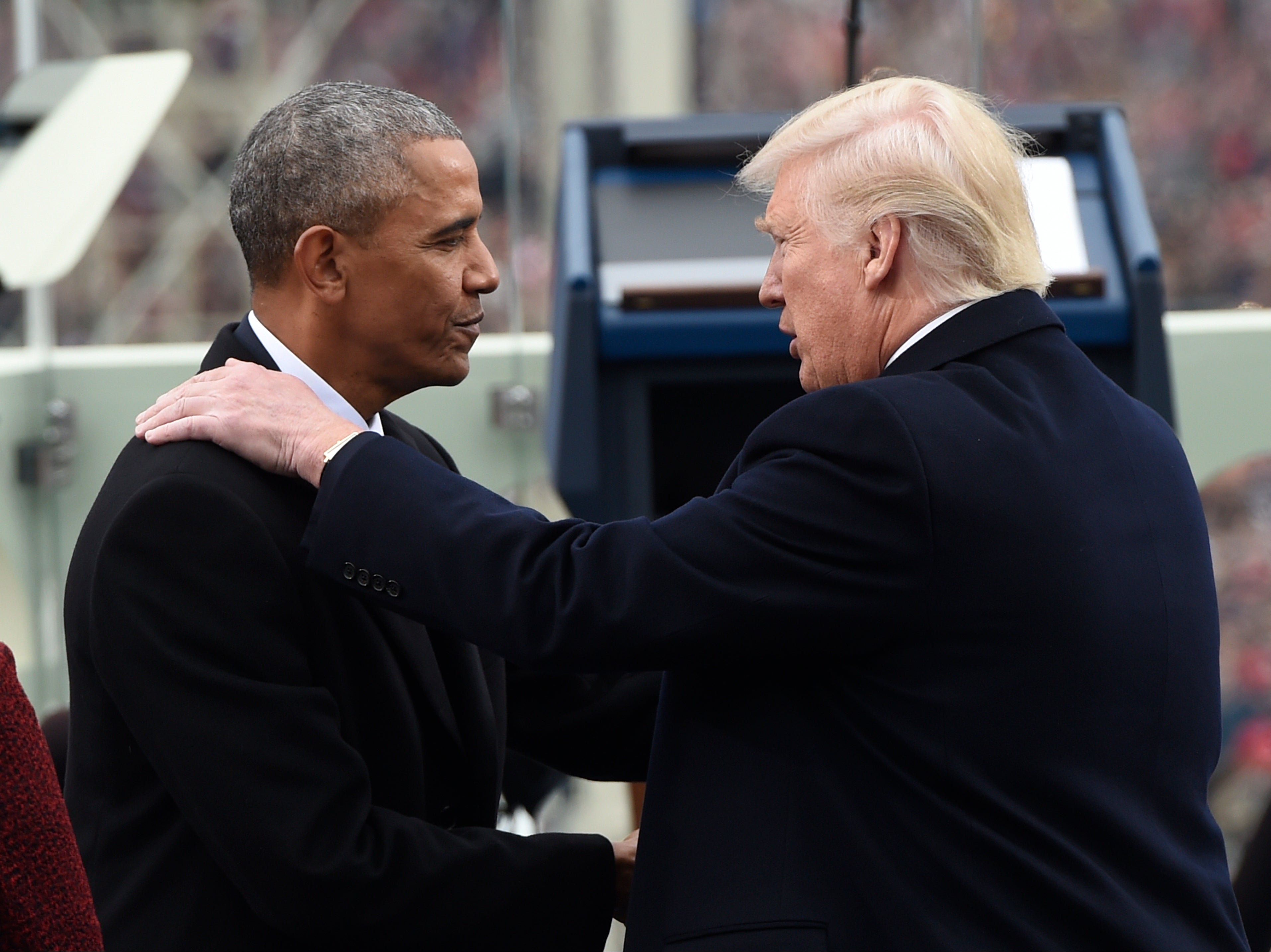 Former US president Barack Obama shakes hands with Donald Trump during the inauguration at the US Capitol on January 20, 2017