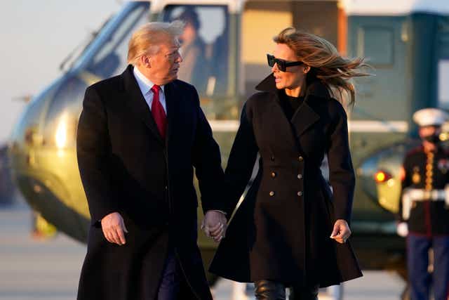 <p>President Donald Trump and first lady Melania Trump walk to board Air Force One at Andrews Air Force Base, Md., Wednesday to travel to Mar-a-Lago</p>