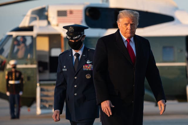 US President Donald Trump walks to board Air Force One prior to departure from Joint Base Andrews in Maryland, December 23, 2020, as they travel to Mar-a-lago for Christmas and New Year's. (Photo by SAUL LOEB / AFP) 