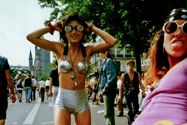 <p>Partygoers take to the streets of Berlin during the 1994 Love Parade</p>