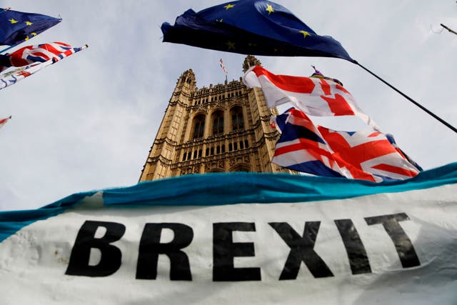 A pro-Brexit banner is seen outside the Houses of Parliament in London on October 30. 2019. A Brexit deal has been struck between the UK and EU.