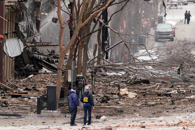 <p>Police in Nashville survey the devastation after a motorhome exploded on Christmas Day</p>