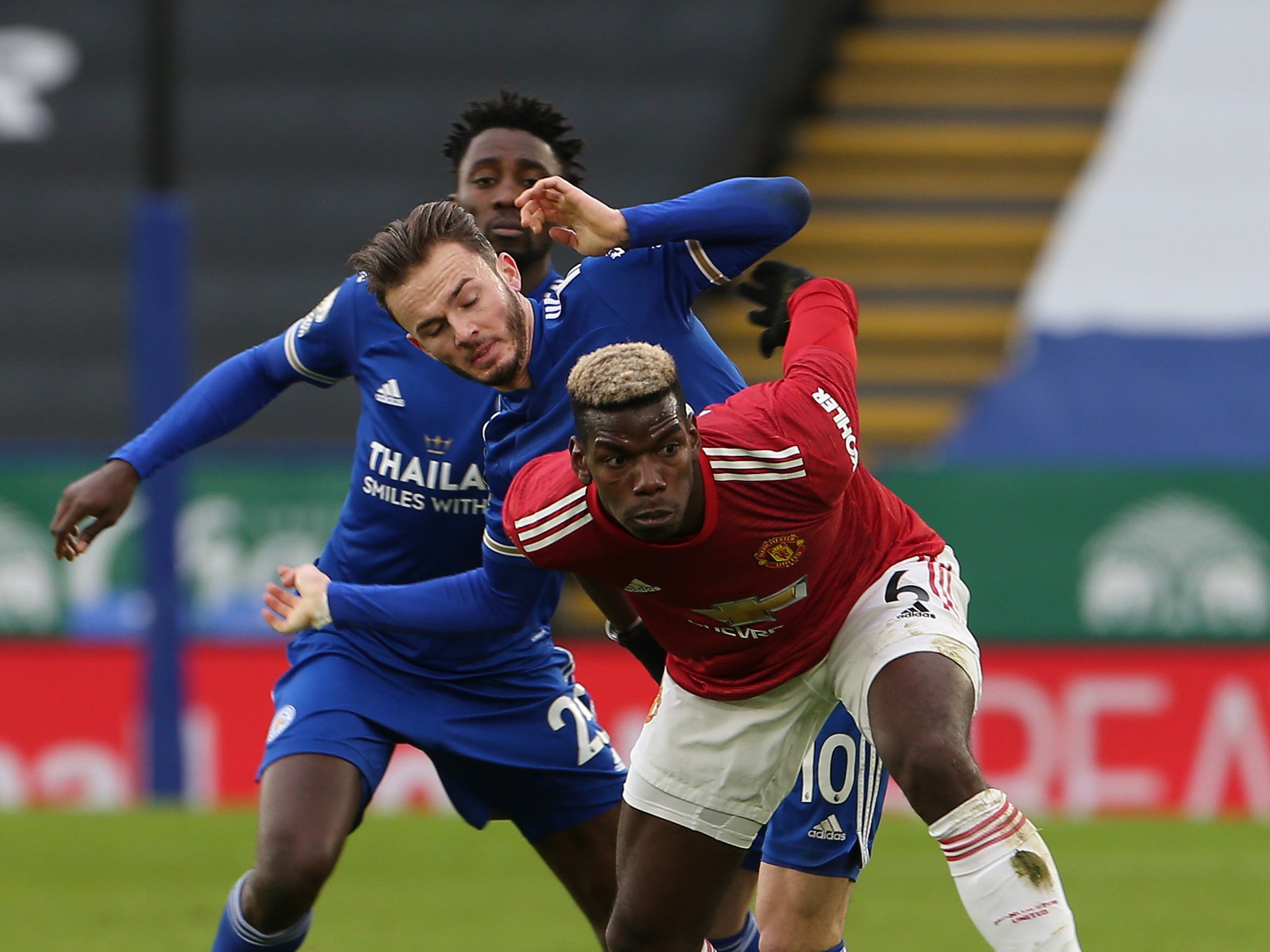 Paul Pogba vies for the ball against Leicester