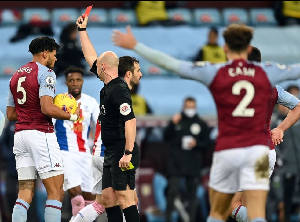 <p>Tyrone Mings is sent off after separate fouls on Wilfried Zaha</p>