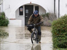 Storm Bella hits UK with 100mph gusting winds and flooding