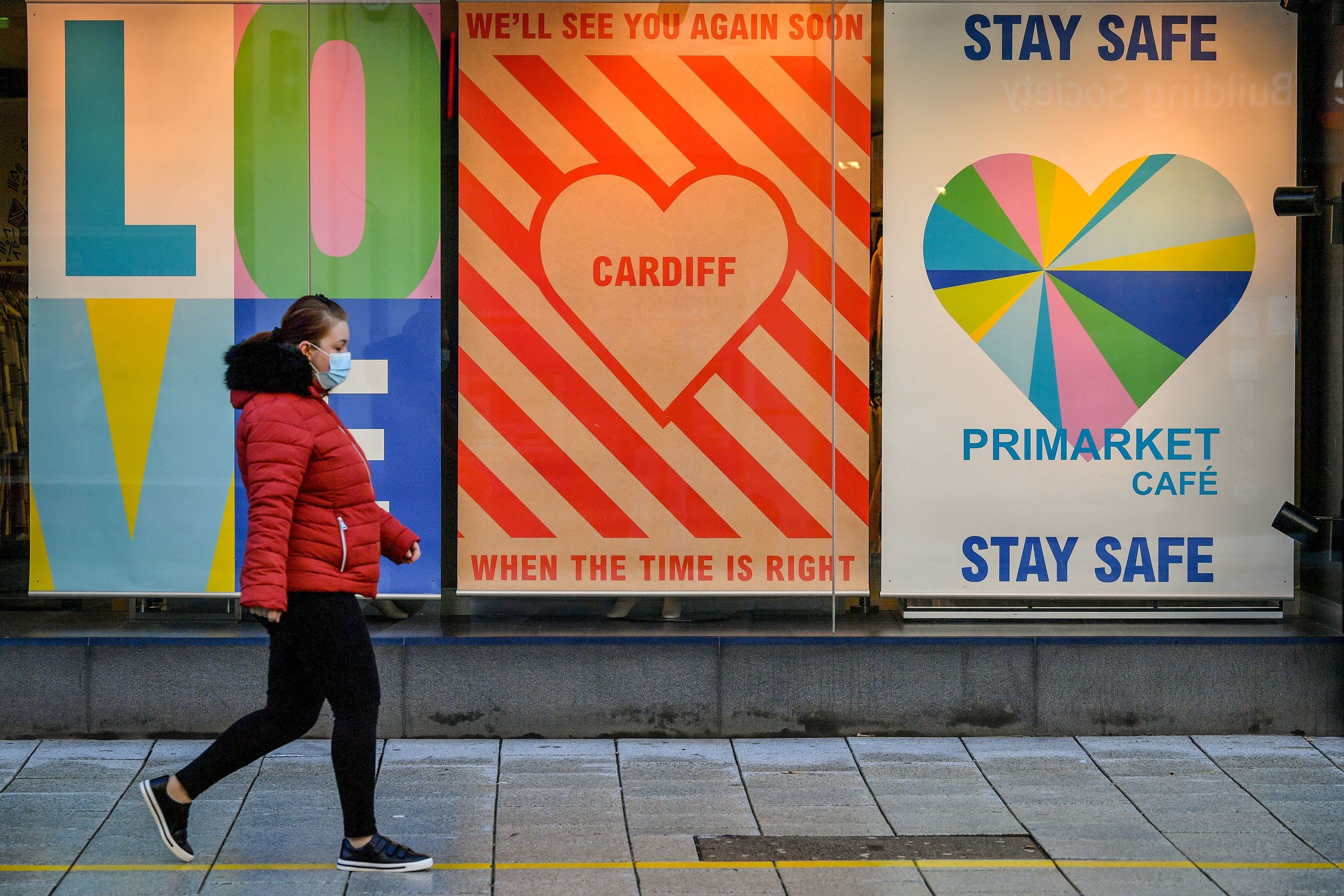 A person walks past Primark in Cardiff city centre as the country battles a second wave of Covid-19 cases