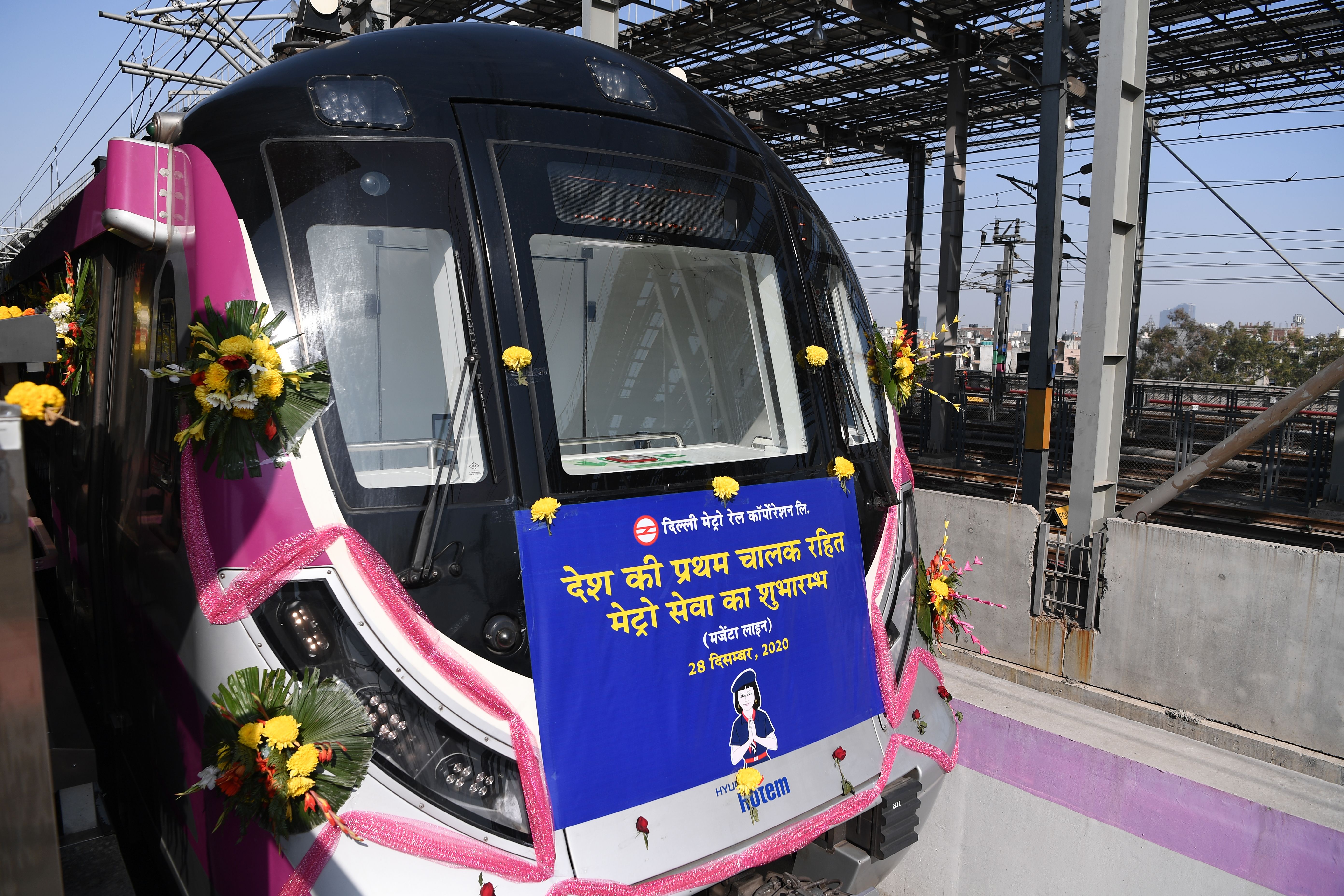 Flowers adorn the front of India’s first driverless metro train at a station during its inauguration in New Delhi on December 28, 2020