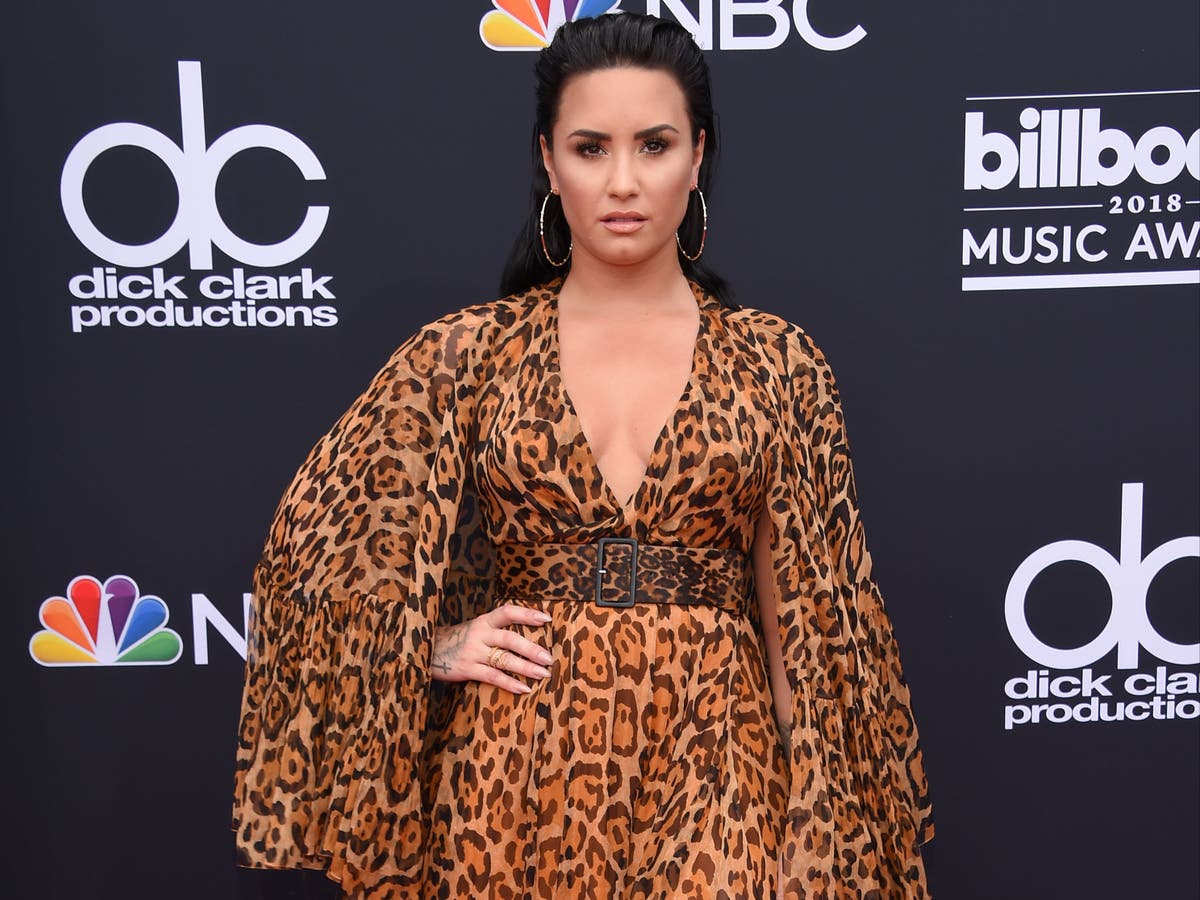 Demi Lovato covers stretch marks in glitter while opening up about eating disorder recovery