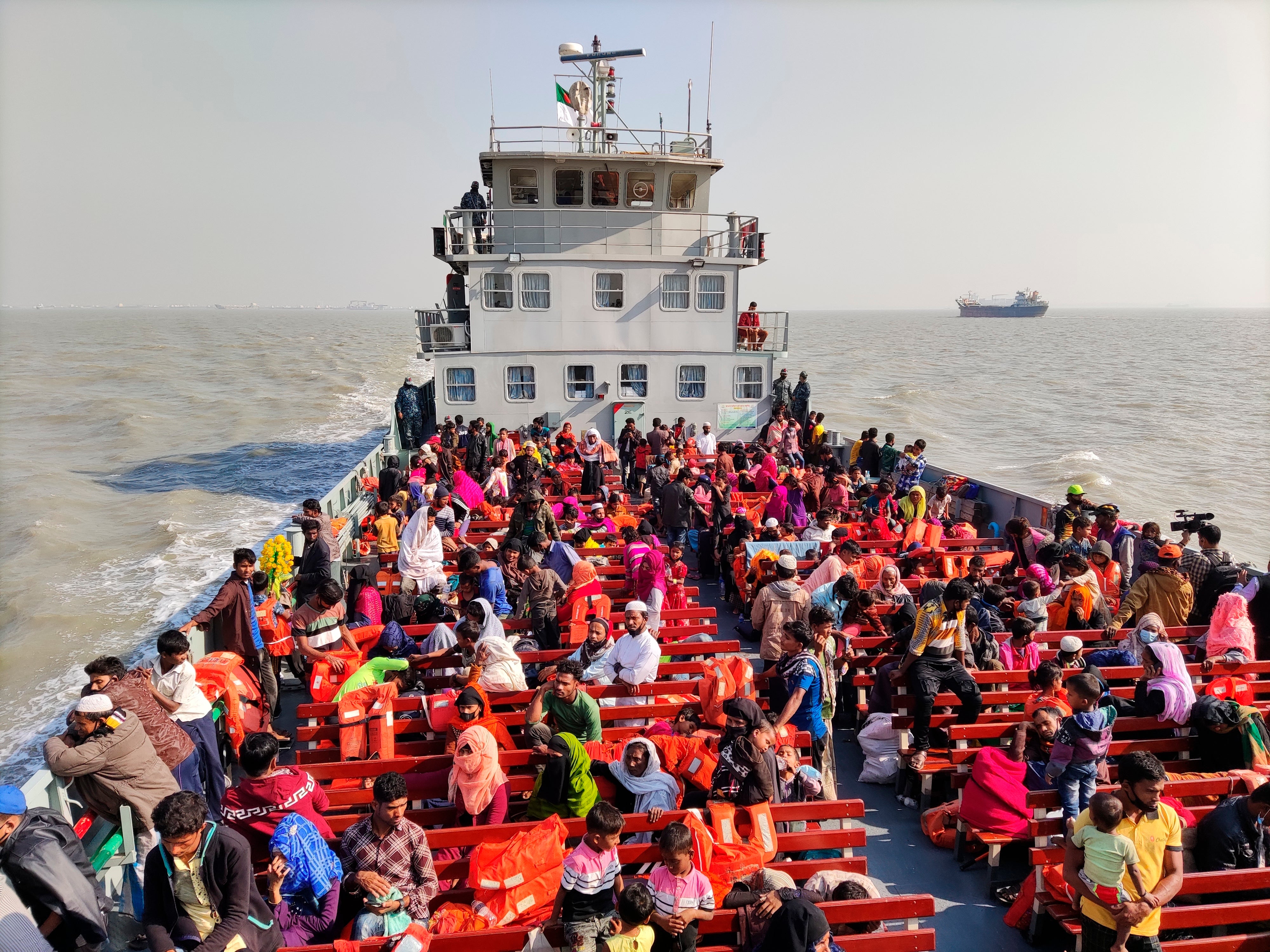 File image: Rohingya refugees travel in a naval ship to be transported to an isolated island in the Bay of Bengal, in December 2020