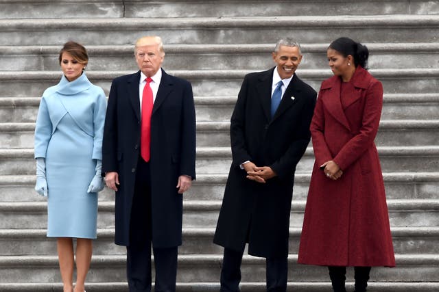 First Lady Melania Trump, President Donald Trump, former President Barack Obama and Michelle Obama stand on the East front steps of the US Capitol after inauguration ceremonies on 20 January, 2017