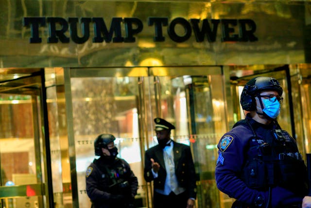 <p>NYPD officers stand guard in front on Trump Tower on 5th Avenue.</p>