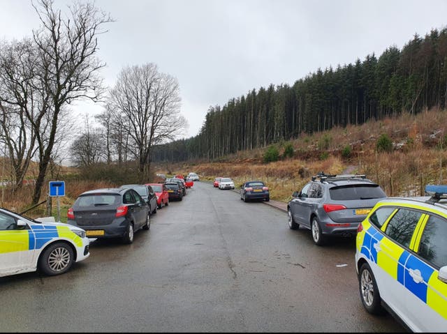 <p>Cars line the roads near Pen-y-Fan in the Brecon Beacons, Wales</p>