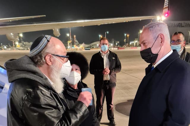 <p>Jonathan and Esther Pollard are greeted by the Israeli PM Benjamin Netanyahu at Tel Aviv airport on Wednesday morning</p>