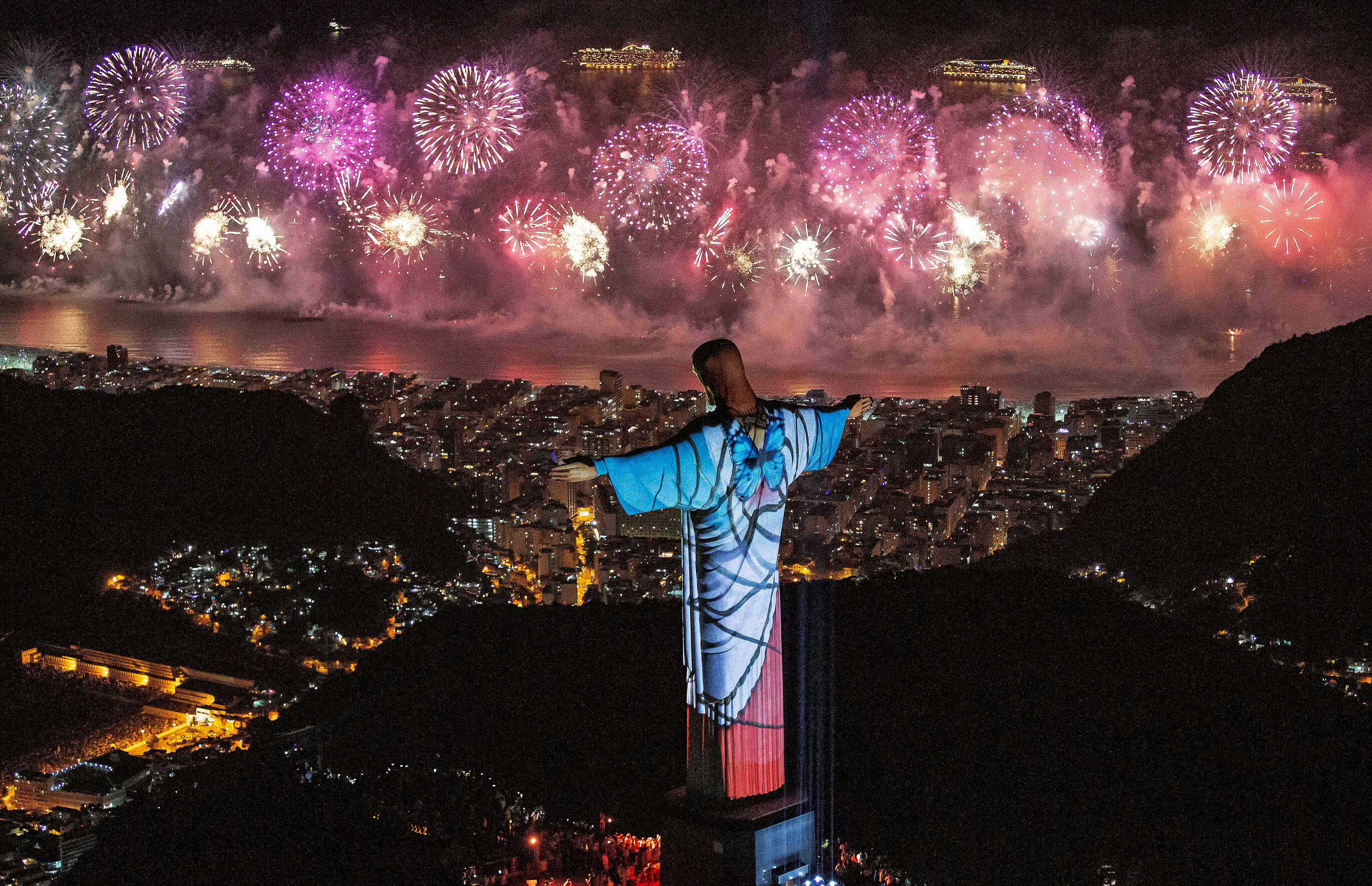 A fireworks display behind Christ the Redeemer during New Year’s Eve celebrations in Rio de Janeiro, Brazil