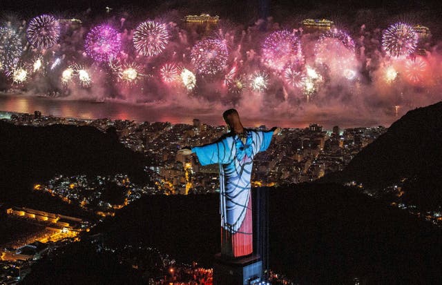 <p>A fireworks display behind Christ the Redeemer during New Year’s Eve celebrations in Rio de Janeiro, Brazil, on 1 January 2020</p>