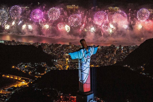<p>A fireworks display behind Christ the Redeemer during New Year’s Eve celebrations in Rio de Janeiro, Brazil, on 1 January 2020</p>